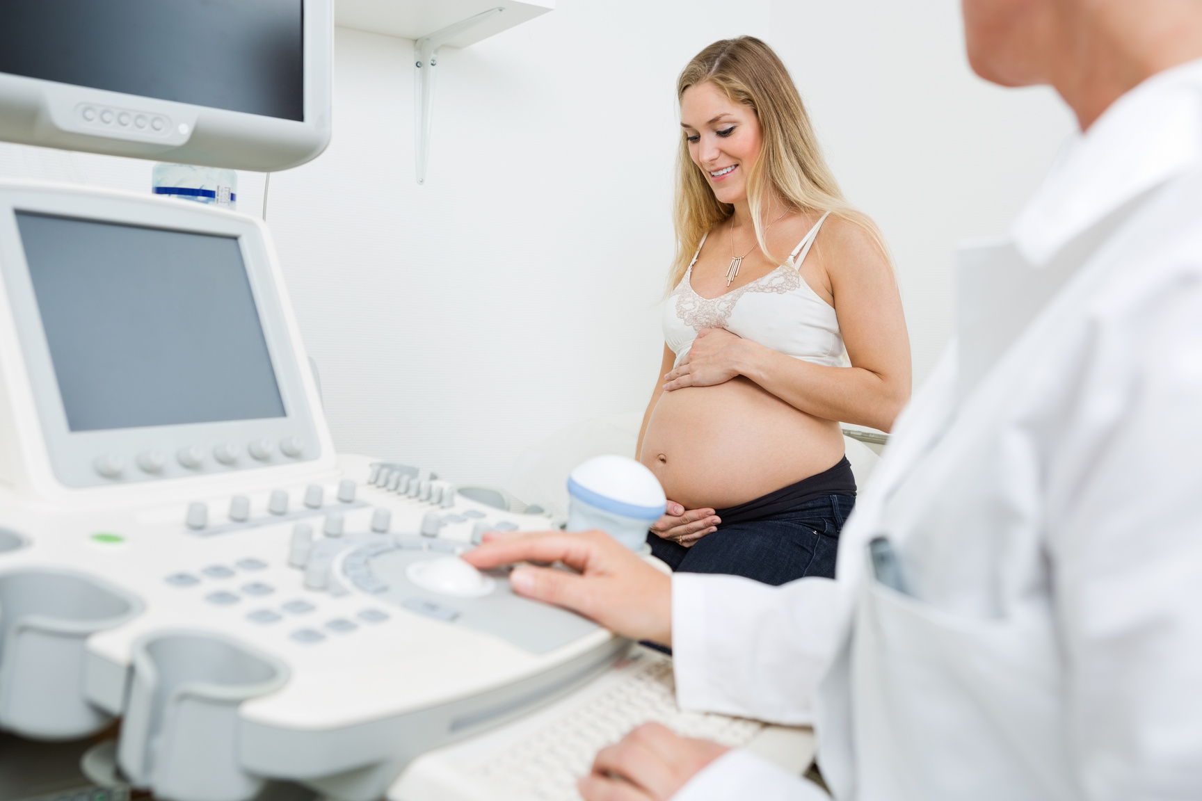 Pregnant Woman with Obstetrician in Clinic